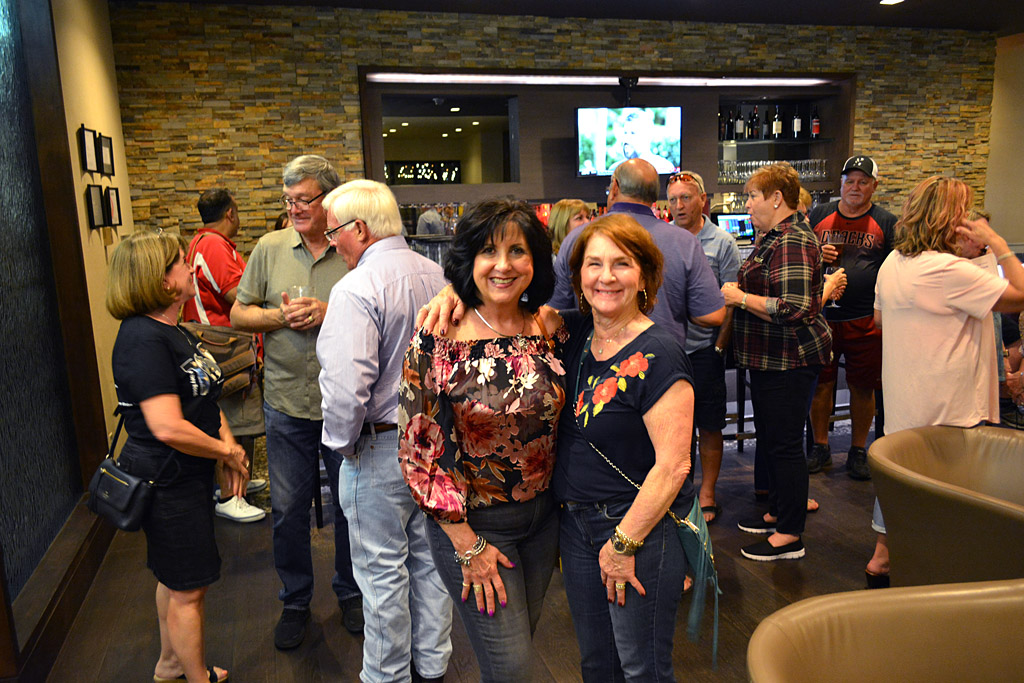 Patty and Norris in middle of lot of people