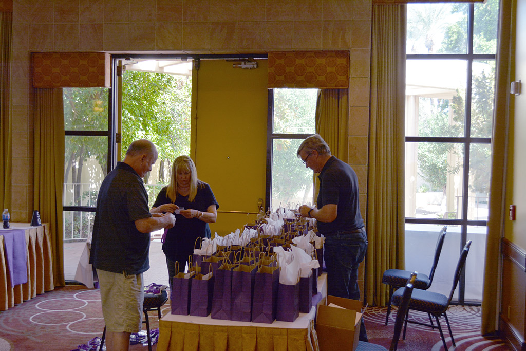 Gary, Christen, David getting the gift bags ready for the ones attending the reunion