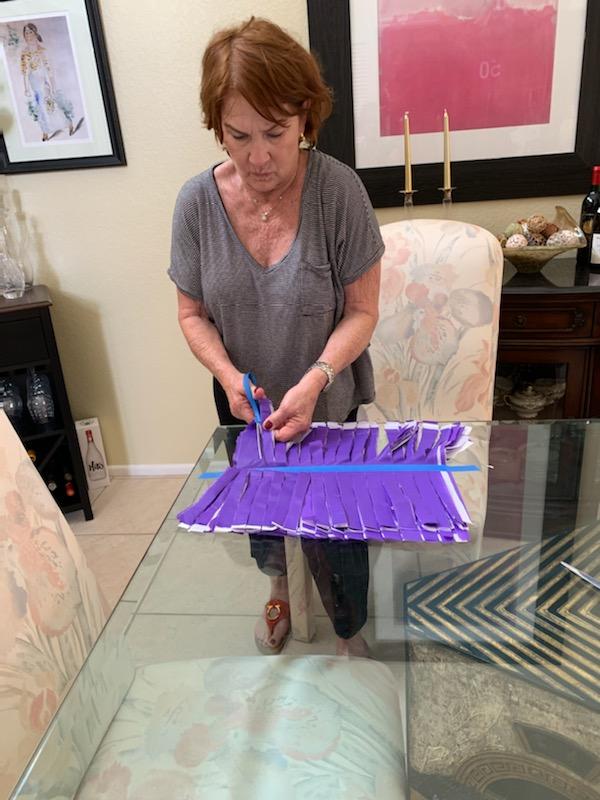 Kathy Norris working on table decorations