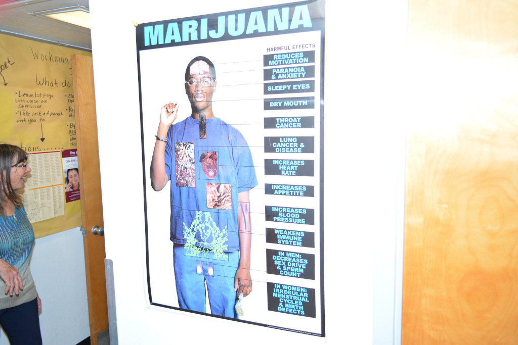 Kathy Whittaker (Winter) checks out marijuana poster